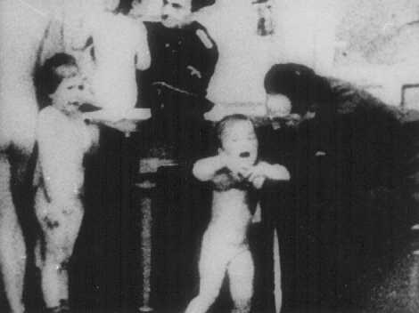 German officers examine Polish children to determine whether they qualify as 