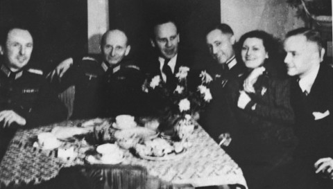 Oskar Schindler (third from left) at a party with local SS officials on his 34th birthday. Schindler attempted to use his connections with German officials to obtain information that might protect his Jewish employees. Krakow, Poland, April 28, 1942.