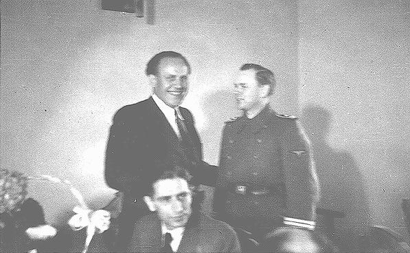 Oskar Schindler (center) at his 34th birthday party with local SS officials. Schindler attempted to use his connections with German officials to obtain information that might protect his Jewish employees. Krakow, Poland, April 28, 1942.