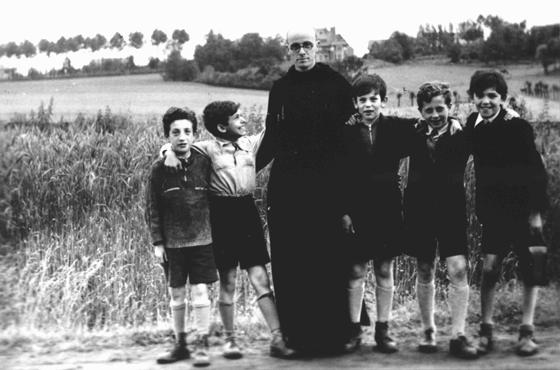 Father Bruno with Jewish children he hid from the Germans. Yad Vashem recognized Father Bruno as 