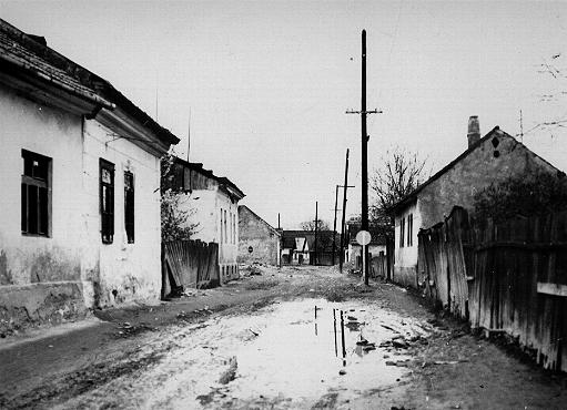 A deserted street in the area of the Sighet Marmatiei ghetto. This photograph was taken after the deportation of the ghetto population. Sighet Marmatiei, Hungary, May 1944.