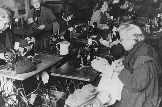 Forced laborers at work in a tailor's workshop. Theresienstadt ghetto, Czechoslovakia, between 1941 and 1945.
