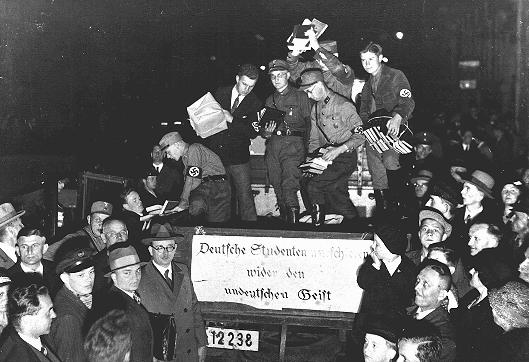 Students and members of the SA unload books deemed "un-German" during the book burning in Berlin. The banner reads: "German students march against the un-German spirit." Berlin, Germany, May 10, 1933.