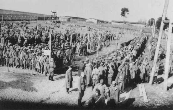 Germans guard prisoners in the Rovno camp for Soviet prisoners of war. Rovno, Poland, after June 22, 1941.