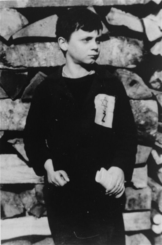 A Jewish child wears the compulsory Star of David badge with the letter "Z" for Zidov, the Croatian word for Jew. Yugoslavia, probably 1941.