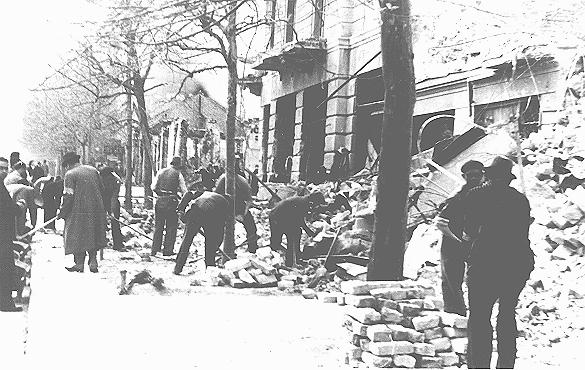 Jews forced to clear rubble from streets following the bombardment of Belgrade. Belgrade, Yugoslavia, 1941.