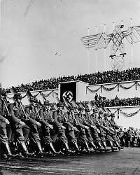 Members of the Reich Labor Service march during a celebration at the Nazi Party Congress in Nuremberg in 1935. Males ages 18 to 25 were subject to conscription by the Nazi state in road building, land reclamation, and farming.
