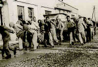 Dachau inmates perform forced labor. 1933.