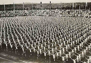 Thousands of girls execute a rhythmic calisthenics drill during a Nazi Party sporting event at Nuremberg. 1934. Thousands of girls execute a rhythmic calisthenics drill during a Nazi Party sporting event at Nuremberg. 1934.
