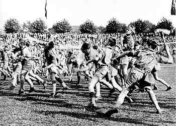 Older members of the Hitler Youth practice throwing hand grenades (“potato mashers”) during a sports festival. June 1936.