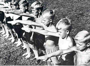 This photograph shows German boys giving the Nazi salute. September 1933.