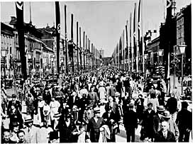 The main boulevard in Berlin is decorated with Nazi banners in preparation for the Olympics. July- August 1936.