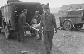American medical personnel evacuate Langenstein survivors...