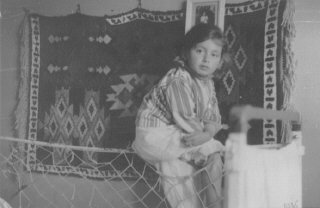 Portrait of a young Jewish girl, Lida Kleinman sitting...