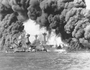 Smoke billows out from US ships hit during the Japanese...