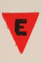 Unused red triangle concentration camp patch with an E found by a US military aid worker