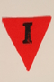 Unused red triangle concentration camp patch with an I found by a US military aid worker