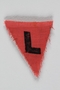Unused red triangle concentration camp patch with an L found by a US military aid worker
