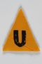 Unused yellow triangle concentration camp patch with a U found by a US military aid worker