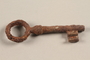 Large, rusted metal key recovered from Chelmno killing center
