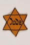 Yellow cloth Star of David badge with the word Jude