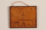 Small wooden tile with the Terezin church steeple made by a former Jewish Czech concentration camp inmate
