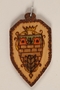 Small colored wooden pendant with Terezin crest made by a former Jewish Czech concentration camp inmate