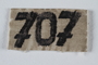 Numbered badge from a concentration camp prisoner's uniform