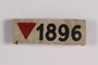 White badge with an inverted red triangle and number 1896 worn by a gay concentration camp inmate