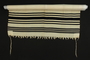 White wool tallit with black stripes brought with a German Jewish refugee
