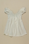 Child's white smocked dress worn by 2 sisters while living in hiding