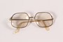 Gold metal eyeglasses worn by a former resident of the Lvov ghetto