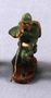 Toy Nazi Wehrmacht figurine in a green uniform crouching with a rifle acquired by a US family in Vienna