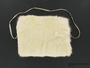 Child's white rabbit fur hand muff received in a displaced persons camp