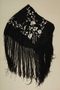 Fringed black silk piano shawl with embroidered silver flowers brought to the US by a Jewish family fleeing German occupied Poland