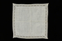 White cotton lace handkerchief with a floral motif lace border brought to the US by a Jewish family fleeing German occupied Poland