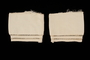 Two white silk sleeve cuffs with stitched whitework borders brought to the US by a Jewish family fleeing German occupied Poland