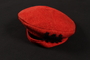 Red wool felt cap with stick figure silhouettes worn by a young Austrian Jewish refugee to the US