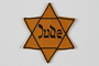 Yellow Star of David badge with Jude worn by a young German Jewish boy