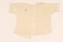 Infant’s open back white blouse with a light blue monogram made in DP camp