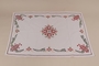 Tablecloth embroidered with a multicolored floral design recovered by Kato Ritter from her neighbors