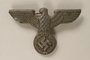 Pressed tin cap badge of a Reichsadler acquired by a US soldier