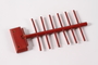 Red wooden tie rack made by a Dutch Jew while living in hiding