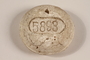 Crematorium tag, number 5893, acquired at Dachau postwar by a US soldier