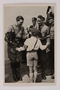 Cigarette card photo of a smiling Hitler with roses and a Hitler Youth member