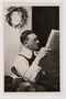 Cigarette card photo of Hitler reading the newspaper