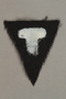 Unused black triangle concentration camp patch with a white letter T found by US forces