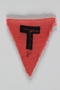 Unused pink triangle concentration camp prisoner patch with a black letter T found by US forces