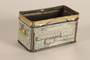 Painted tin container base owned by a German Jewish refugee