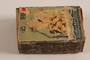 Japanese propaganda matchbox with Japanese planes flying over a sinking ship with a US flag acquired postwar by a German Jewish refugee
